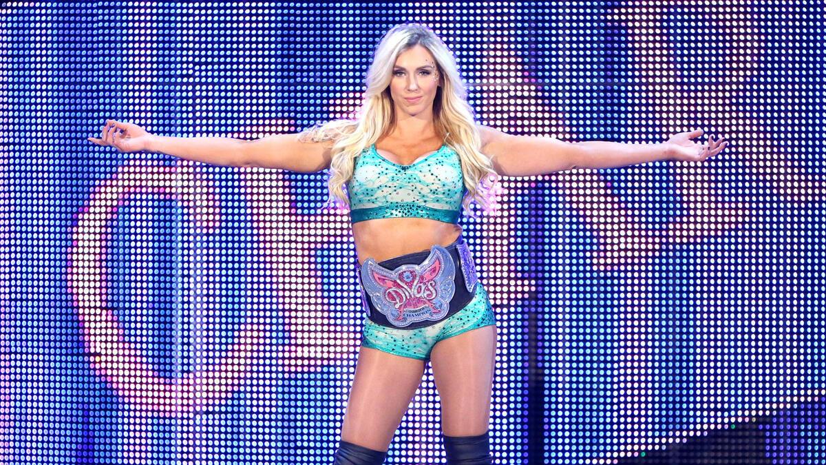 Charlotte Flair makes her entrance with the WWE Divas Championship title belt around her waist at Fastlane 2016
