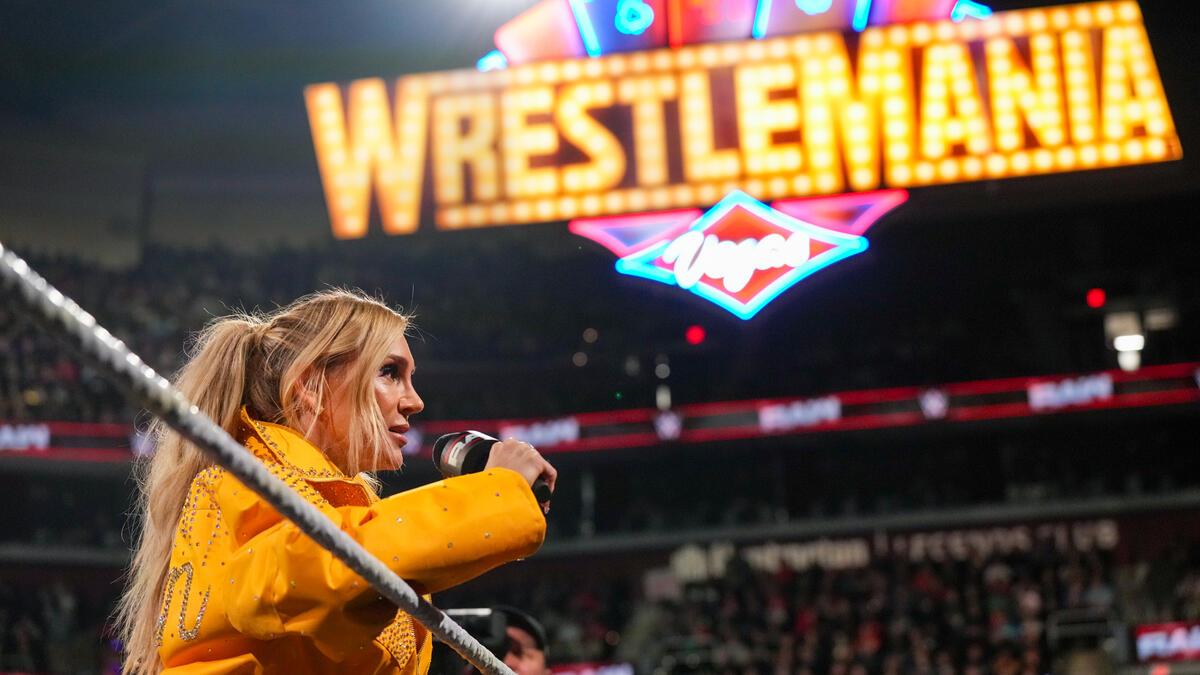 Charlotte Flair standin in front of WrestleMania 41 sign in the ring on WWE Raw