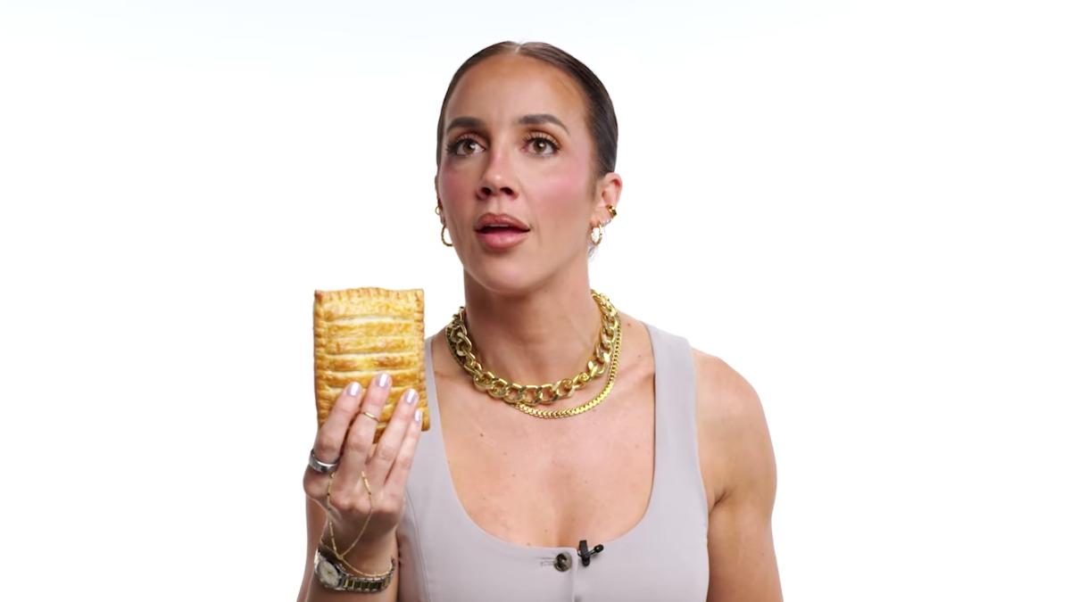 WWE star Chelsea Green holds a Greggs Sausage, Bean and Cheese Melt