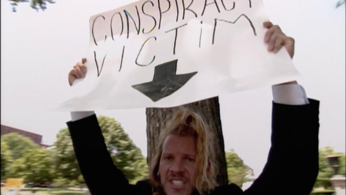 Chris Jericho holding a 'Conspiracy Victim' sign on the June 1, 1998 episode of WCW Nitro