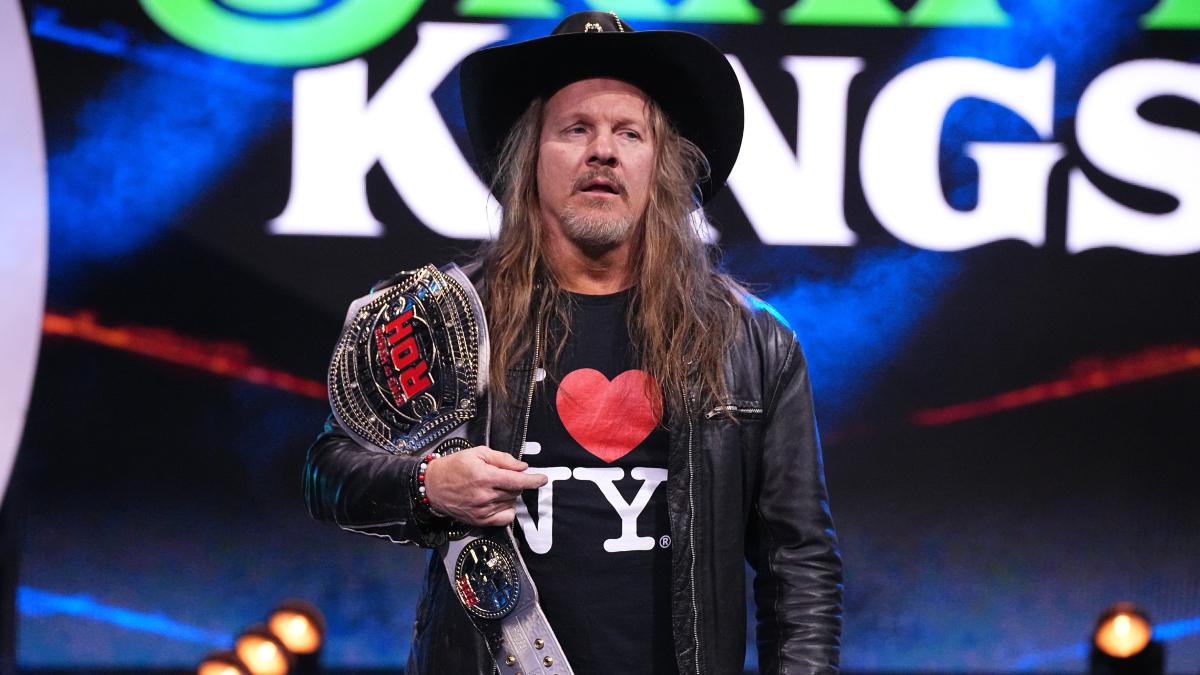 Chris Jericho looking tired holding the ROH World Title while wearing a cowboy hat