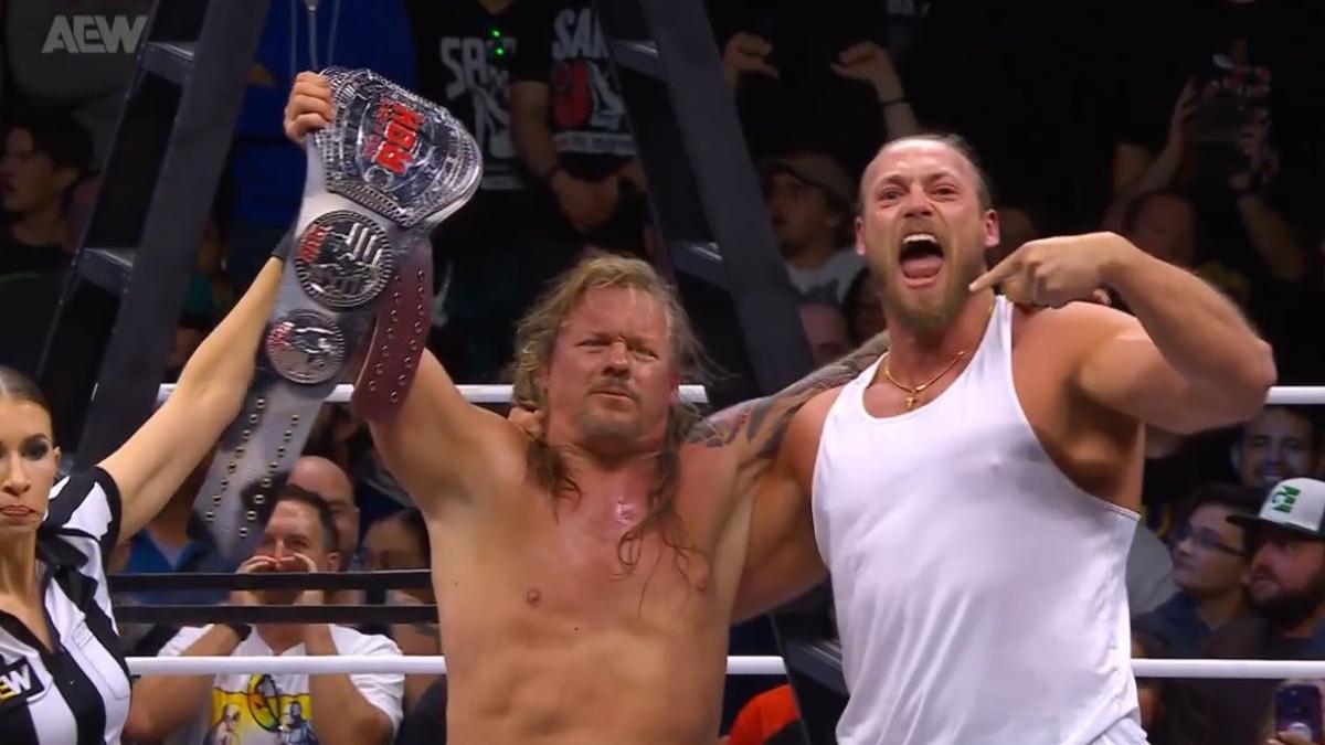 Chris Jericho holding the ROH World Title belt alongside Big Bill