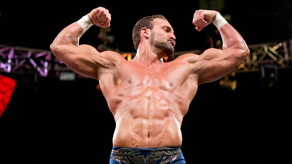 Chris Masters flexes his muscles while making his entrance during a WWE match in 2011