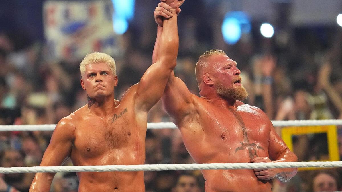 Brock Lesnar raises the hand of his opponent Cody Rhodes following their match at WWE SummerSlam 2023