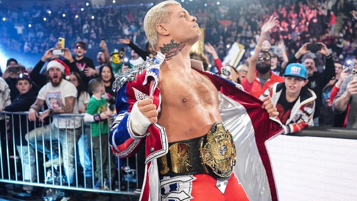 Cody Rhodes opens his entrance robe to reveal the 'winged eagle' WWE Title belt at Saturday Night's Main Event