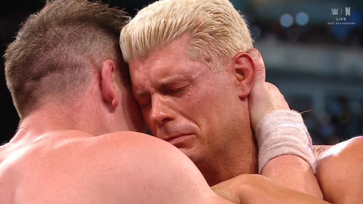 John Cena hugging Cody Rhodes, who is crying