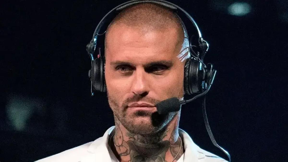 Corey Graves in a white t-shirt with a shaven head