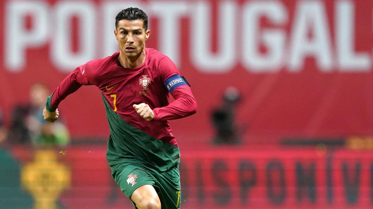 Cristiano Ronaldo running with Portugal shirt on