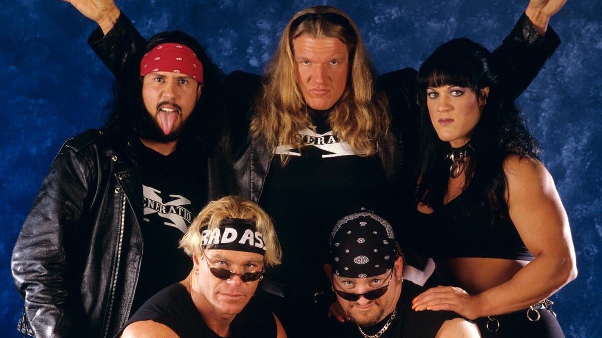 Top row is X-Pac, Triple H and Chyna with Billy Gunn and Road Dogg sat below them in a D-Generation X photoshoot 