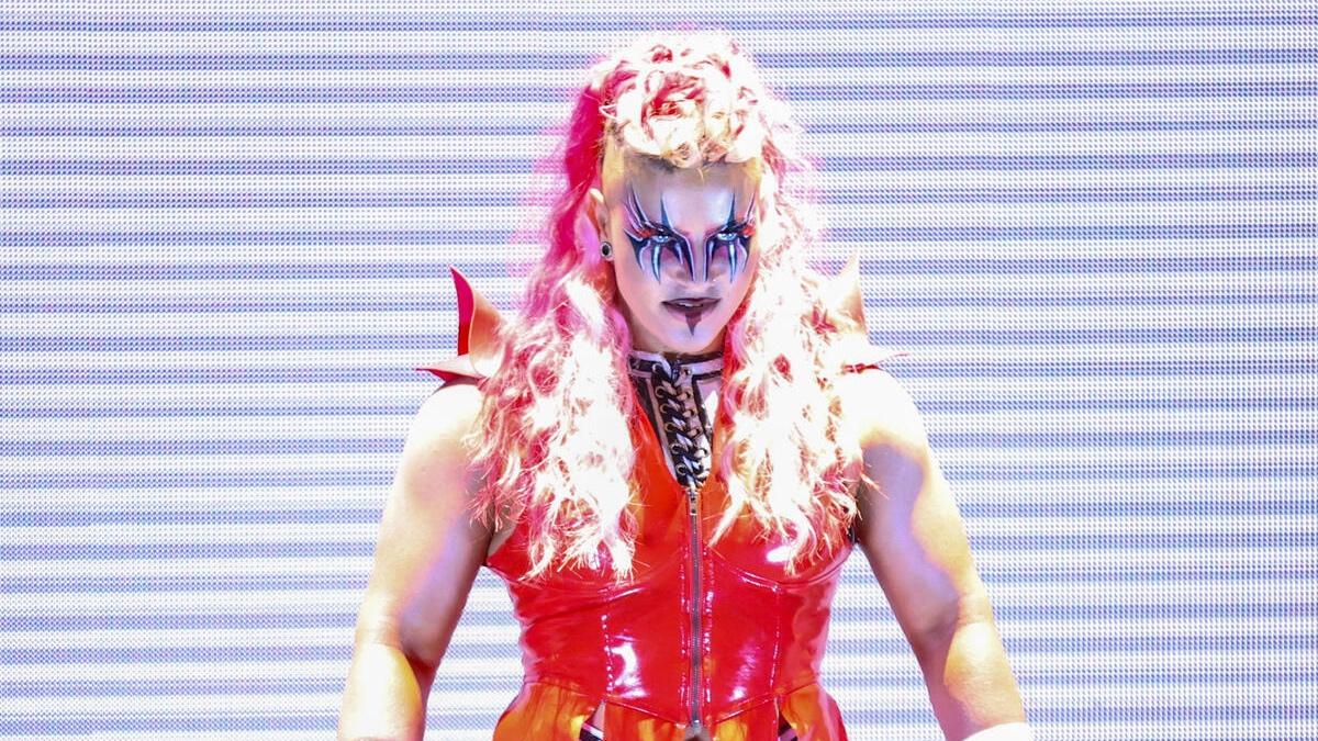 Delta with face paint and a red outfit during her WWE NXT debut