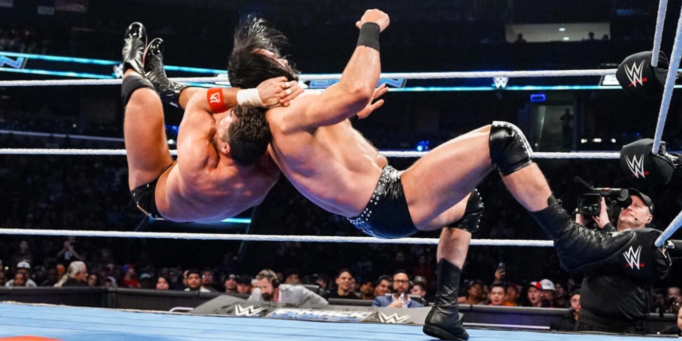 LA Knight hitting a move on Drew McIntyre 