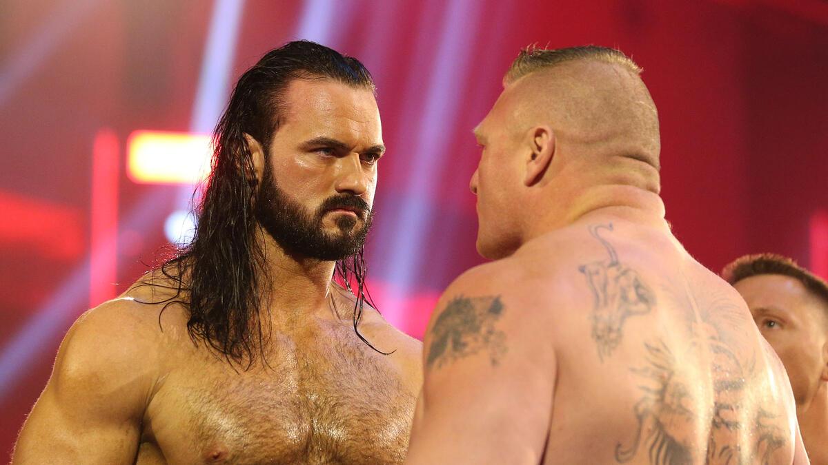 Drew McIntyre and Brock Lesnar staring at each other at WrestleMania 36
