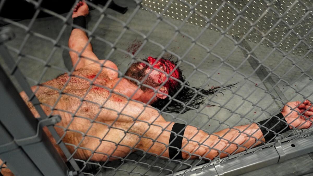 Drew McIntyre lying on the ground covered in blood