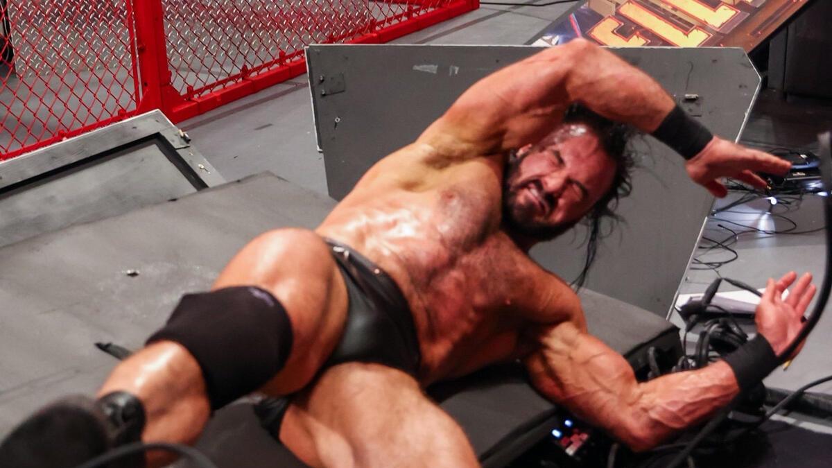 Drew McIntyre in pain after going through the announce table at Hell in a Cell 2020