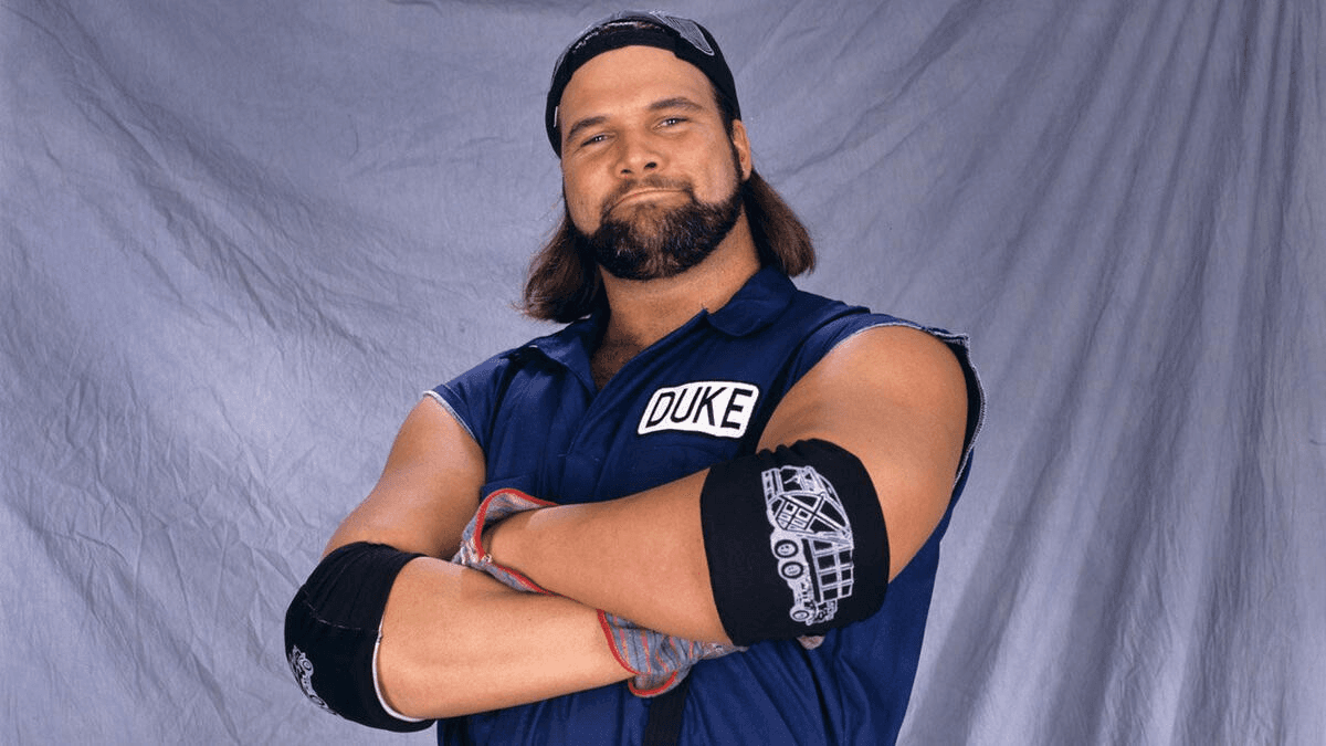 Former WWE star Duke Droese stands with his arms crossed while posing for a promo shot