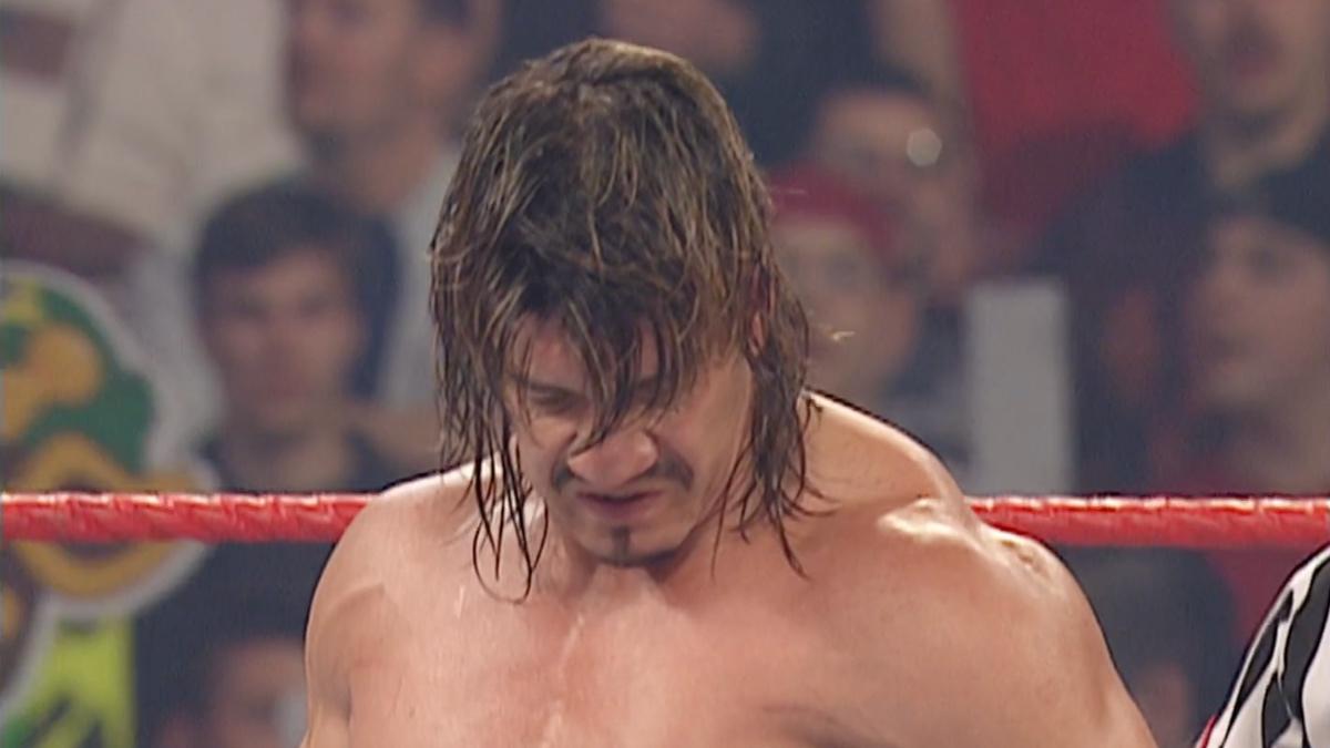 Eddie Guerrero spitting down at an unseen Rob Van Dam