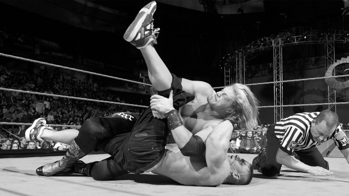 Edge pinning John Cena at WWE New Year's Revolution 2006
