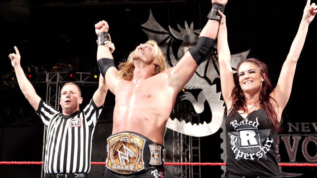 Edge and Lita celebrating his WWE Title win at New Year's Revolution 2006