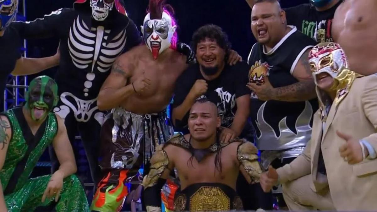 multiple wrestlers celebrating with Vikingo 