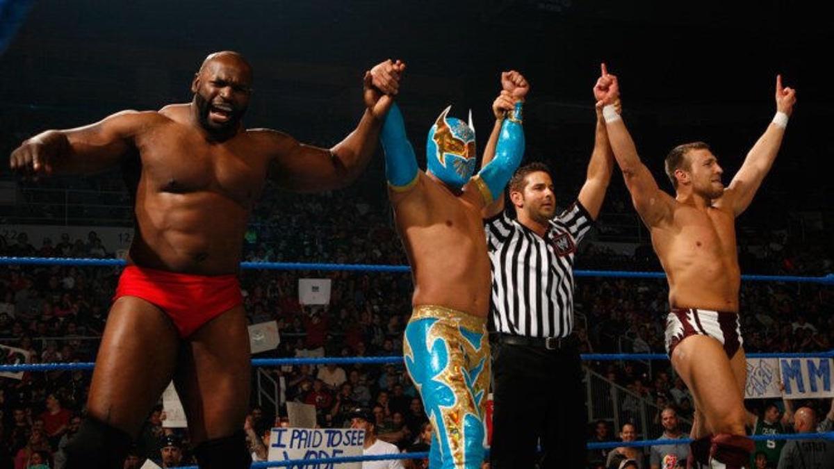 Ezekiel Jackson on the left, Sin Cara in the middle, and Daniel Bryan to the right, celebrating their win on the June 17, 2011 episode of WWE SmackDown