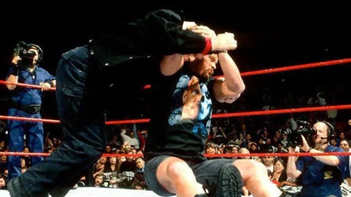 Stone Cold Steve Austin hitting Vince McMahon with a Stunner in 1997
