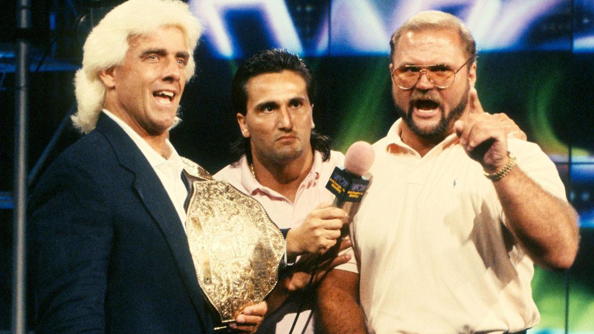 Rick Flair with Arn Anderson and Paul Roma in WCW