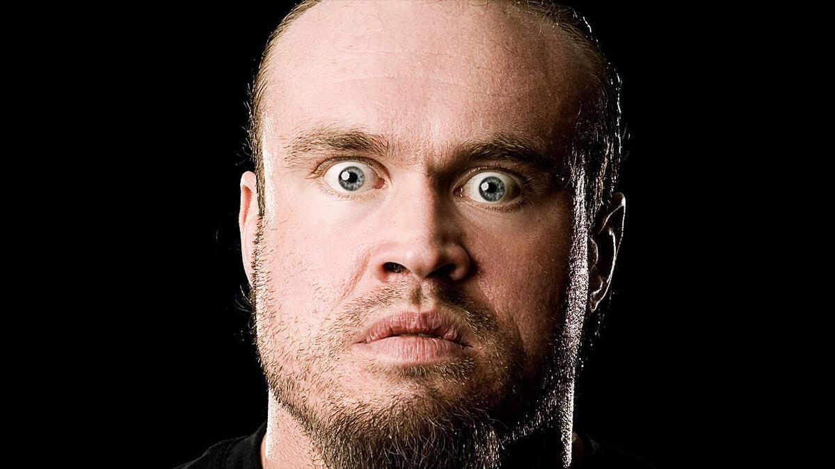 WWE star Gene Snitsky stares straight at the camera for a promotional photo in 2004