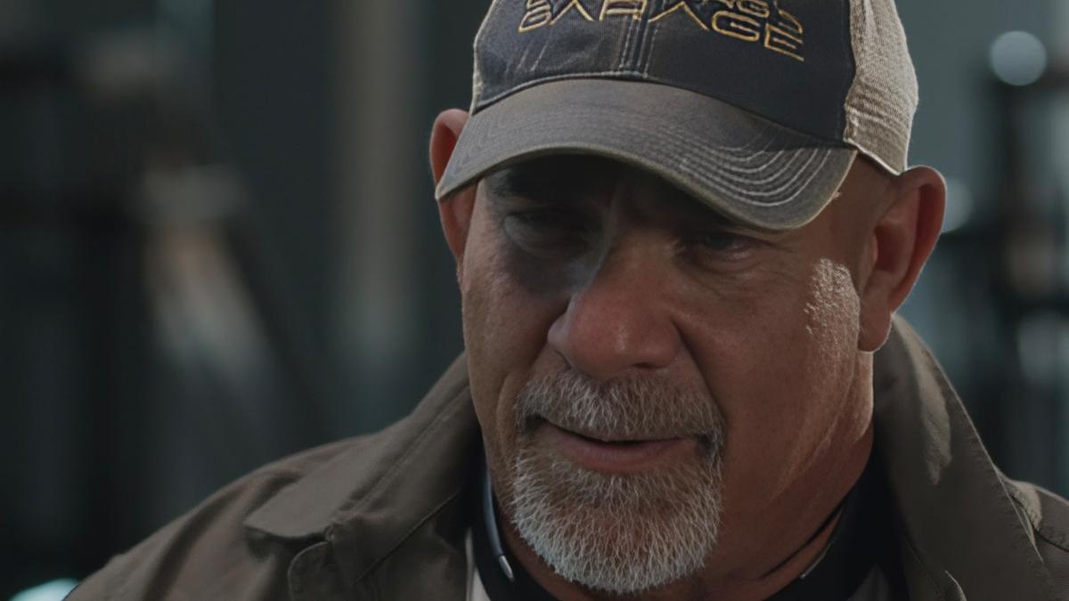 Close-up of Goldberg with grey goatee and wearing a Goldberg's Garage cap
