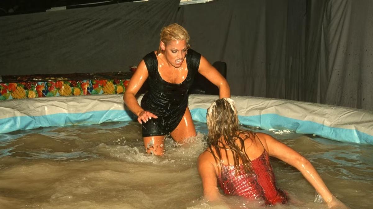 Trish Stratus and Stacey Keibler in a pool full of gravy