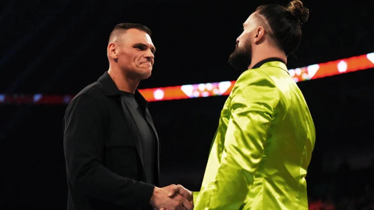 Gunther shaking hands with Seth Rollins