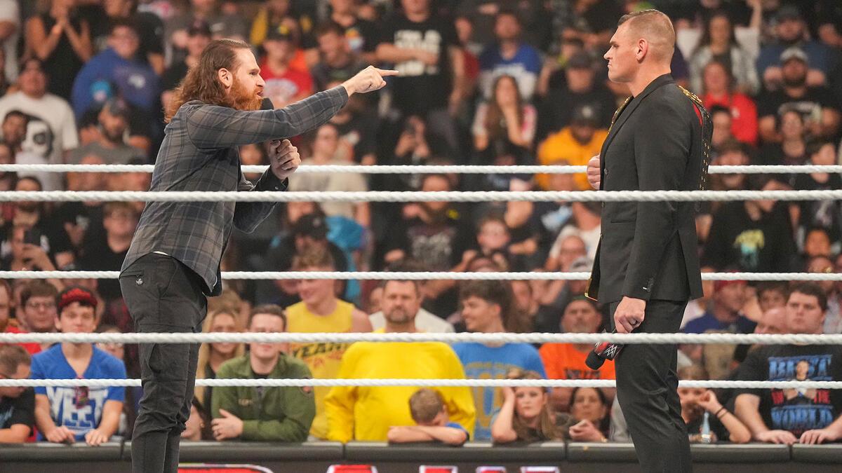 Gunther and Sami Zayn go face-to-face inside a WWE ring, with Sami pointing at Gunther