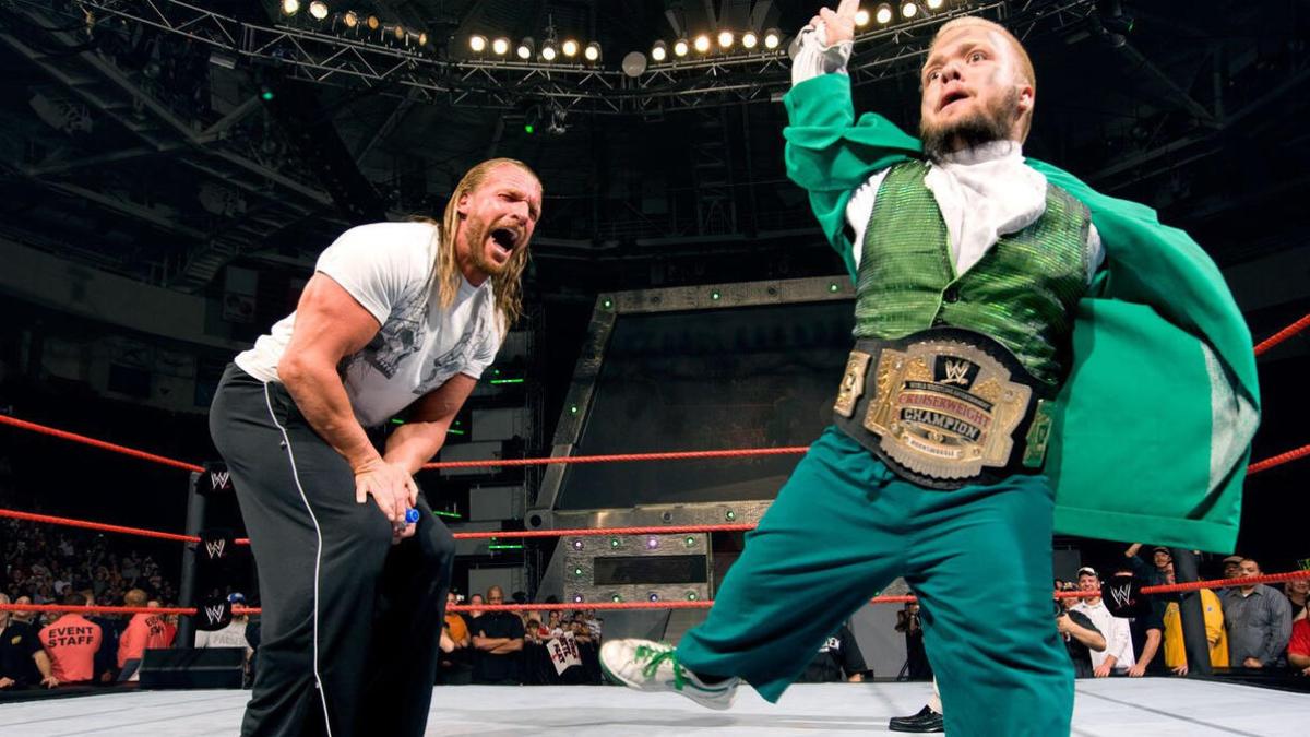 Hornswoggle celebrating with Triple H