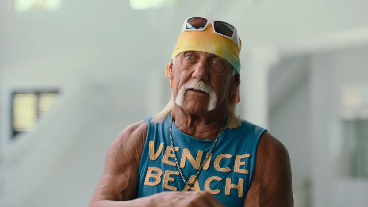 Hulk Hogan wearing a yellow bandana and blue vest