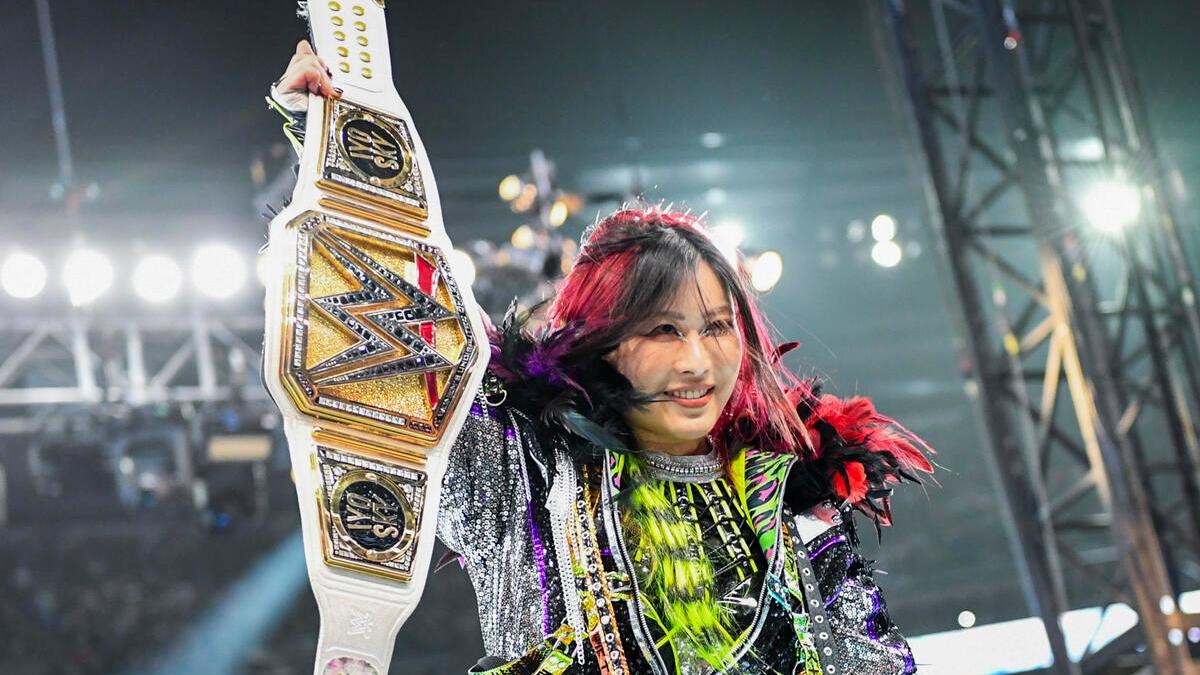 IYO SKY holds the WWE Women's Championship Belt up prior to her match at WrestleMania 40