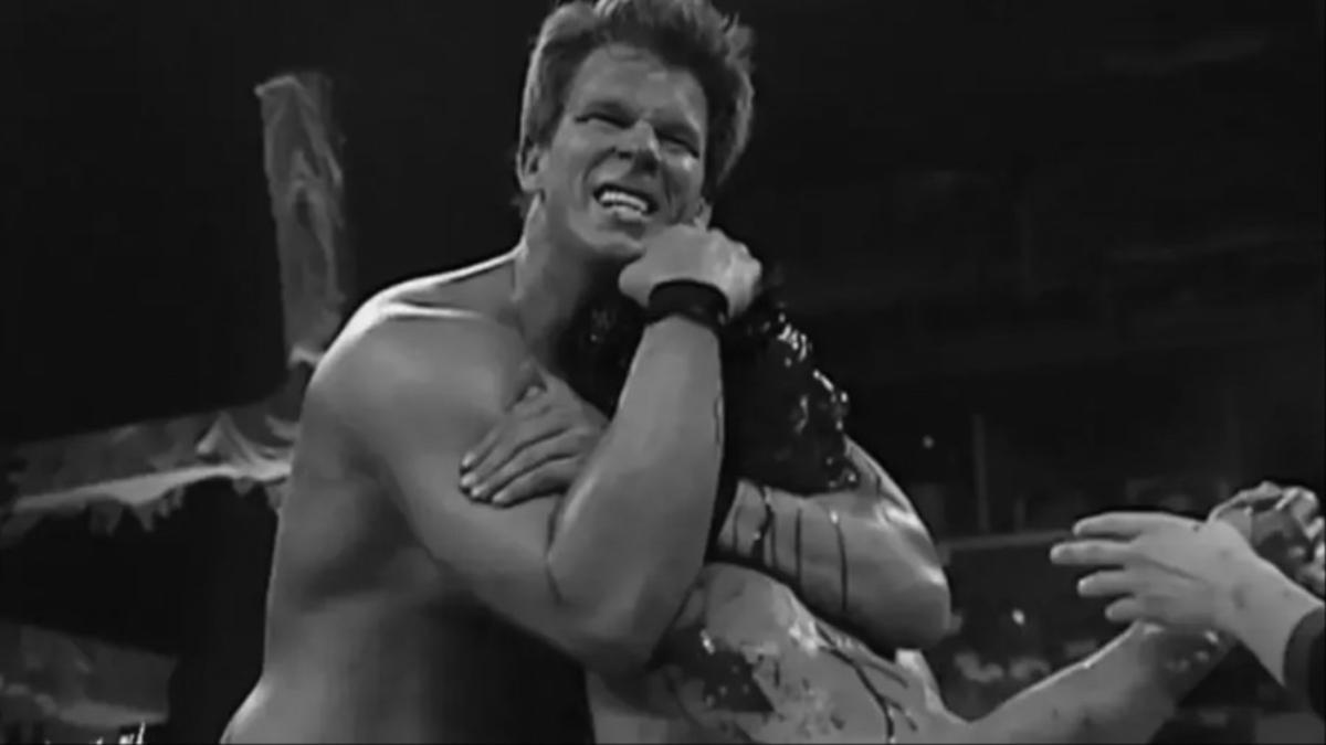 JBL with Eddie Guerrero in a sleeper hold at WWE Judgment Day 2004