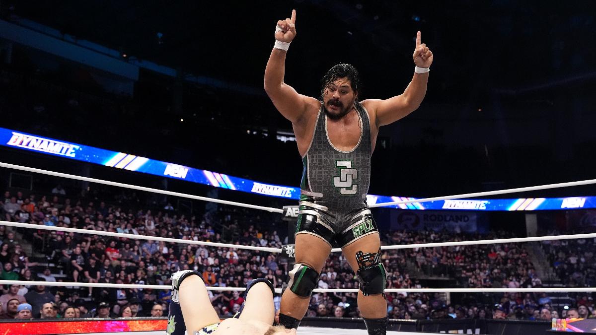 Jeff Cobb mockingly taunts a downed Bryan Danielson inside an AEW ring.