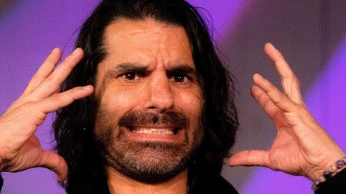 Jimmy Jacobs grimacing and gesturing with hands 