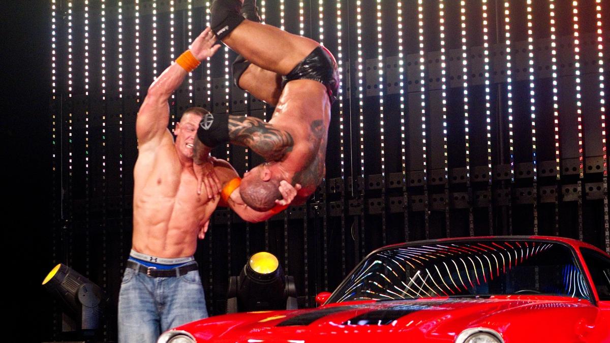 Attitude Adjust from John Cena to Batista on a car