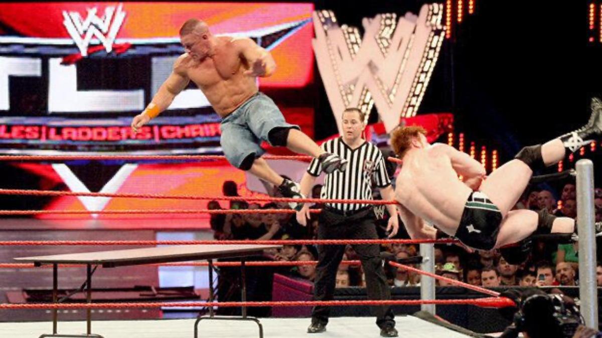 John Cena in mid-air before going through a table at WWE TLC 2009