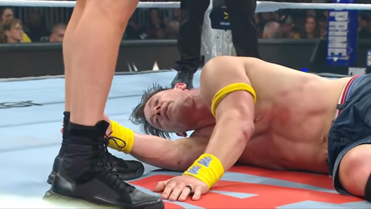 John Cena looking tired while lying in the ring