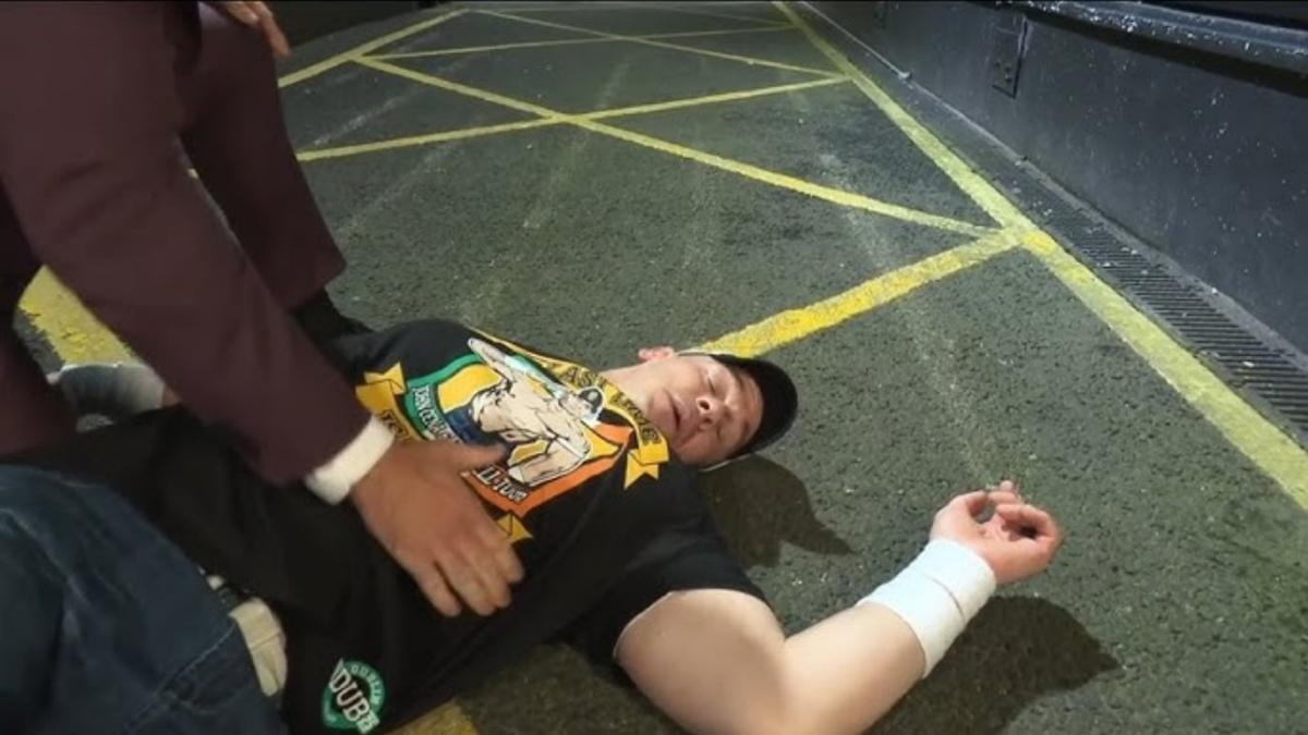 John Cena knocked out on the ground outside 