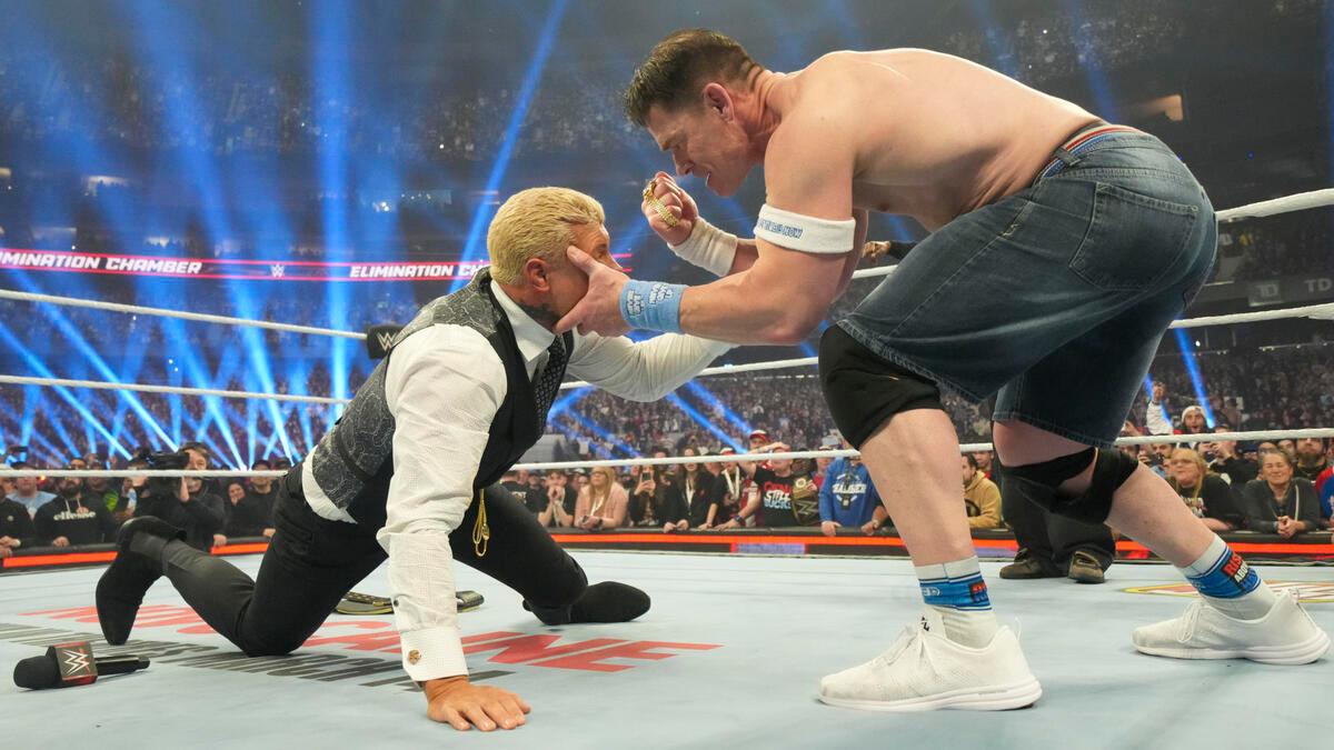 John Cena punching Cody Rhodes at WWE Elimination Chamber 2025