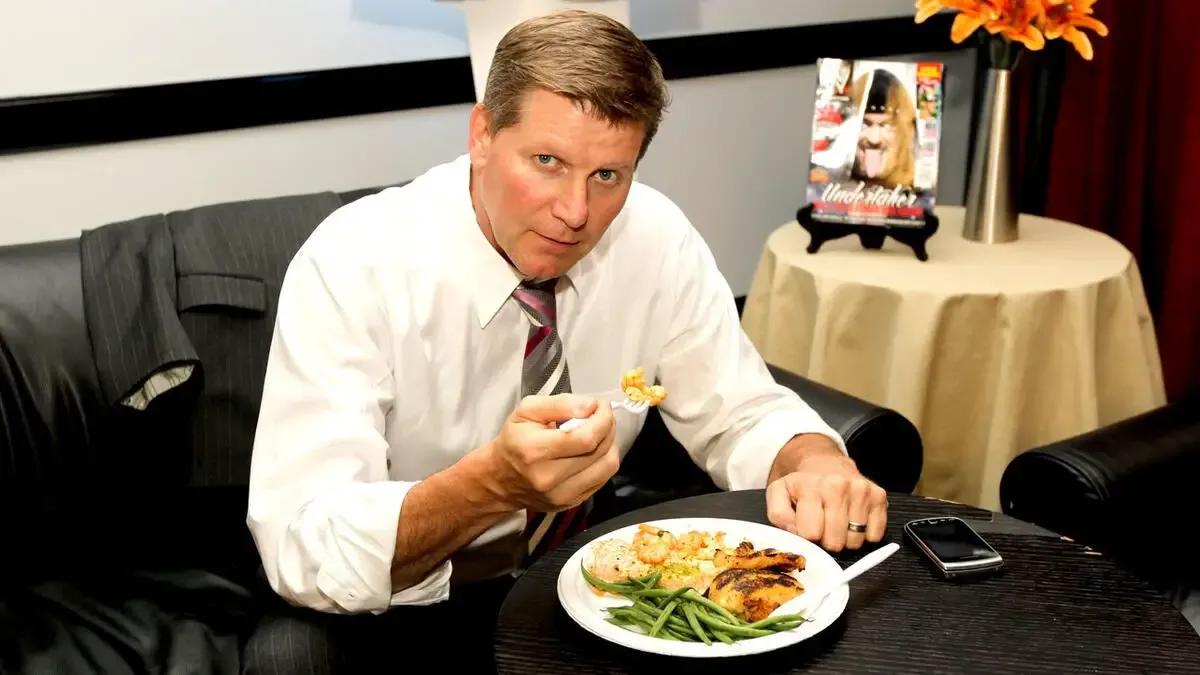 John laurinaitis enjoying catering at wwe over the limit 2012