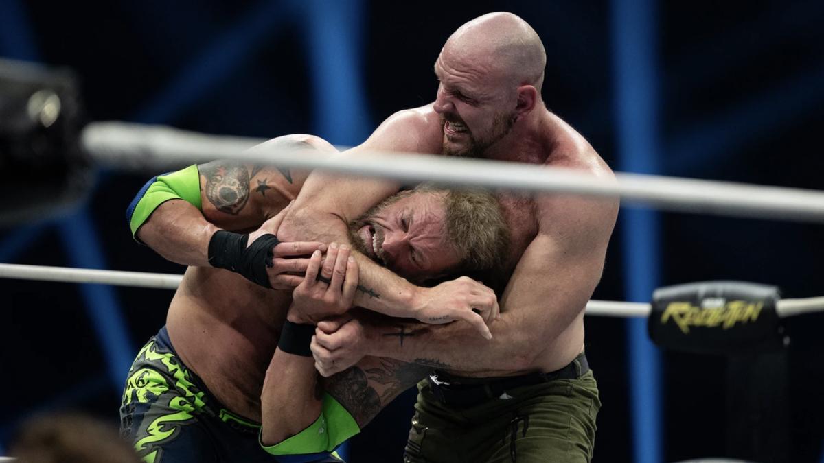 Jon Moxley with a headlock on Cope