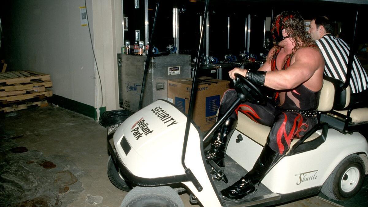 Kane driving a golf cart at WrestleMania X-Seven