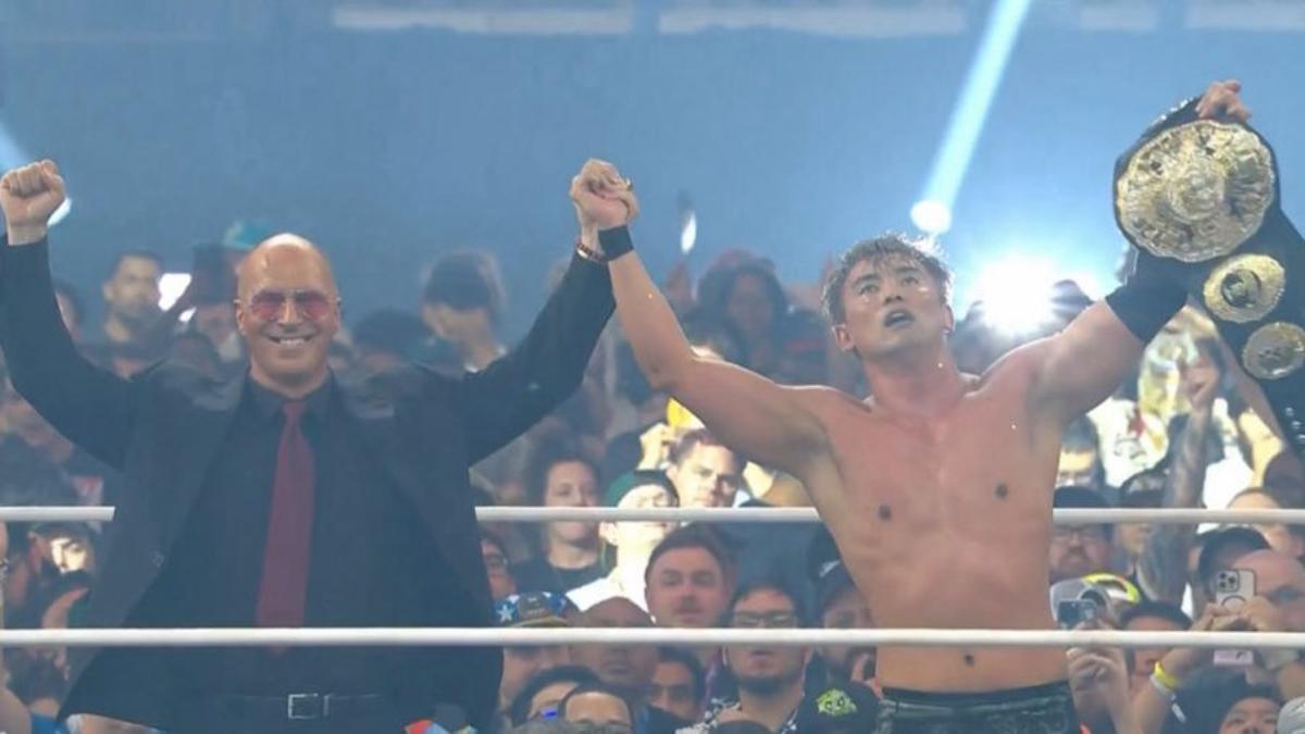 Don Callis and Kzuchika Okada celebrate with the AEW Unified Championship