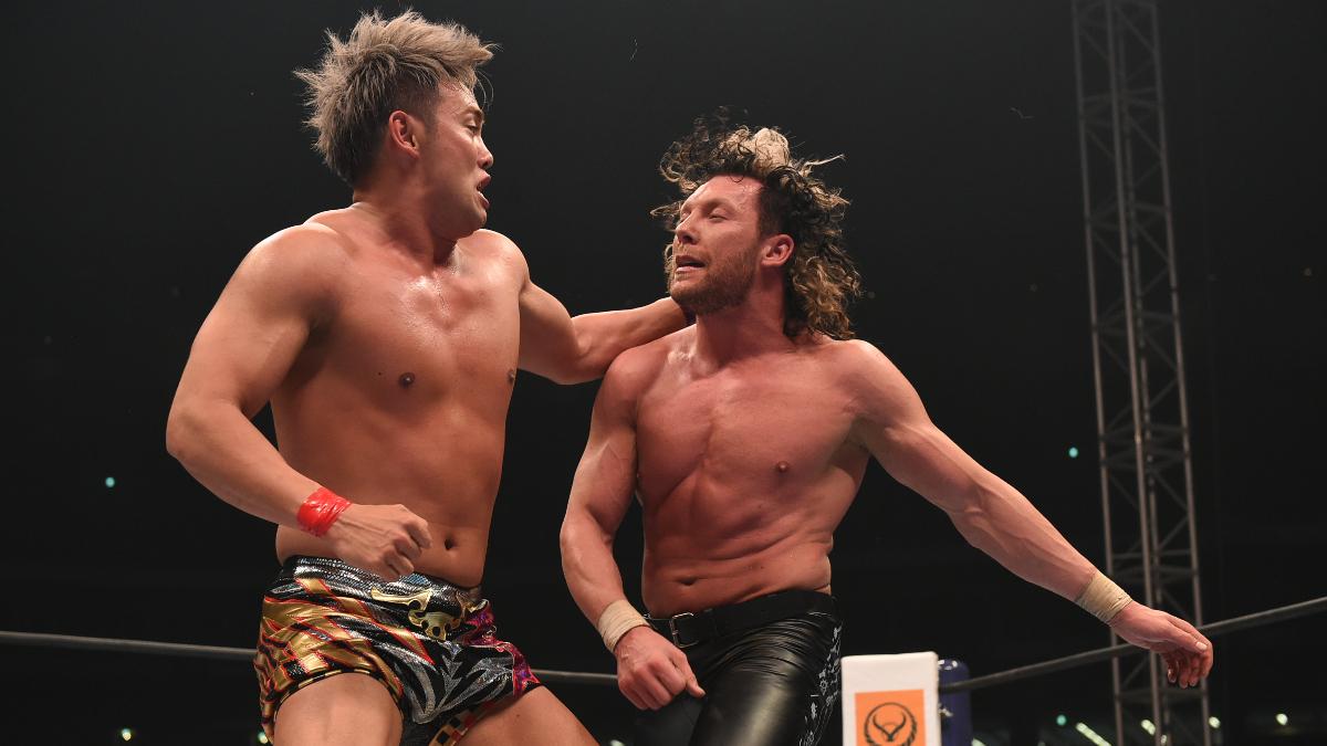 Kazuchika Okada and Kenny Omega exchanging strikes in a New Japan wrestling ring