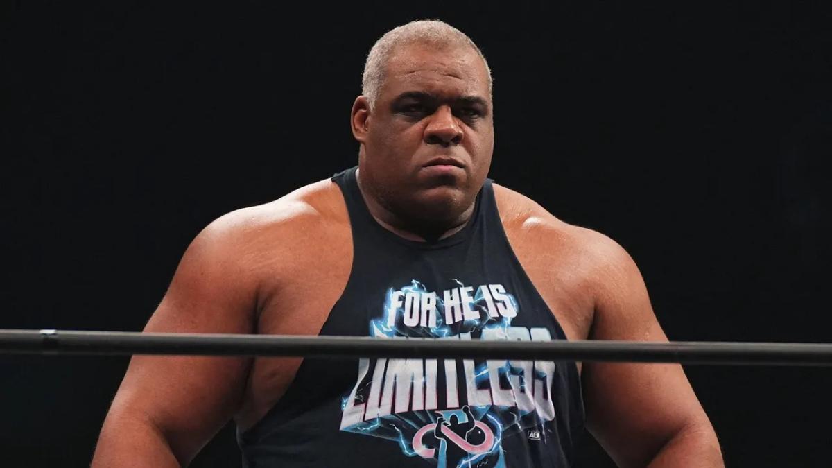 Keith Lee with grey hair in a wrestling ring with a stern expression