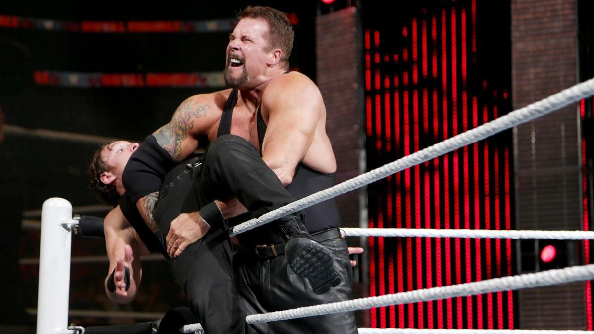 Kevin Nash at WWE Royal Rumble 2014 trying to put Dean Ambrose over the top rope 