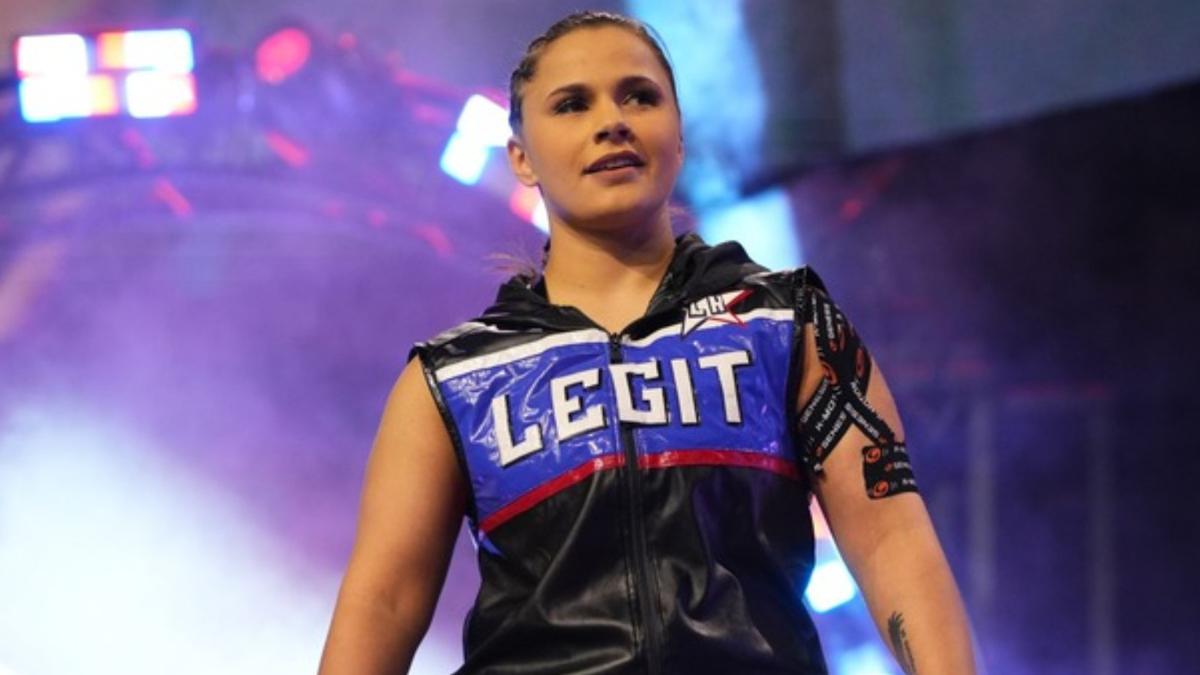 Leyla Hirsch in a sleeveless jacket emblazoned with the word 'Legit'